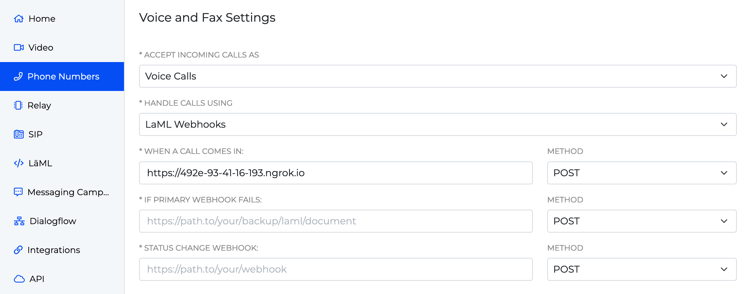 A screenshot of the Voice and Fax Settings for a phone number. The user has elected to handle incoming calls using LaML webhooks connected to the the public ngrok URL connecting to the application.