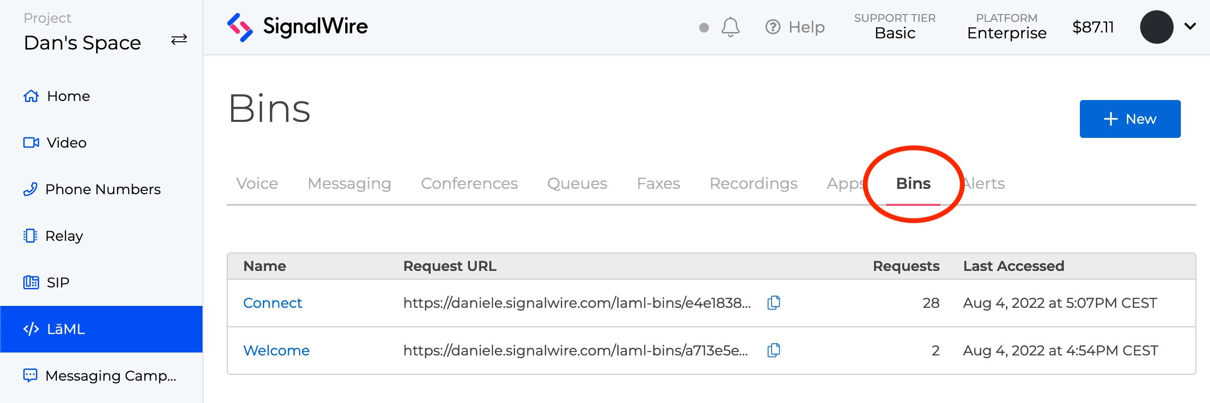 A screenshot of the LaML page within the SignalWire Project called 'Dan's Space'. The Bins tab is circled in red.